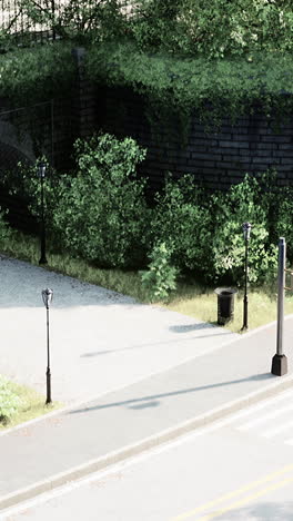 peaceful urban path with lamp posts and greenery