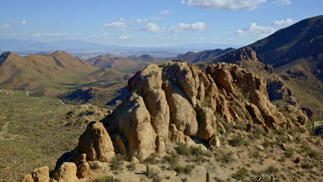 dramatic vista revealed by drone flying the edge of desert mountain ridge in tucson arizona