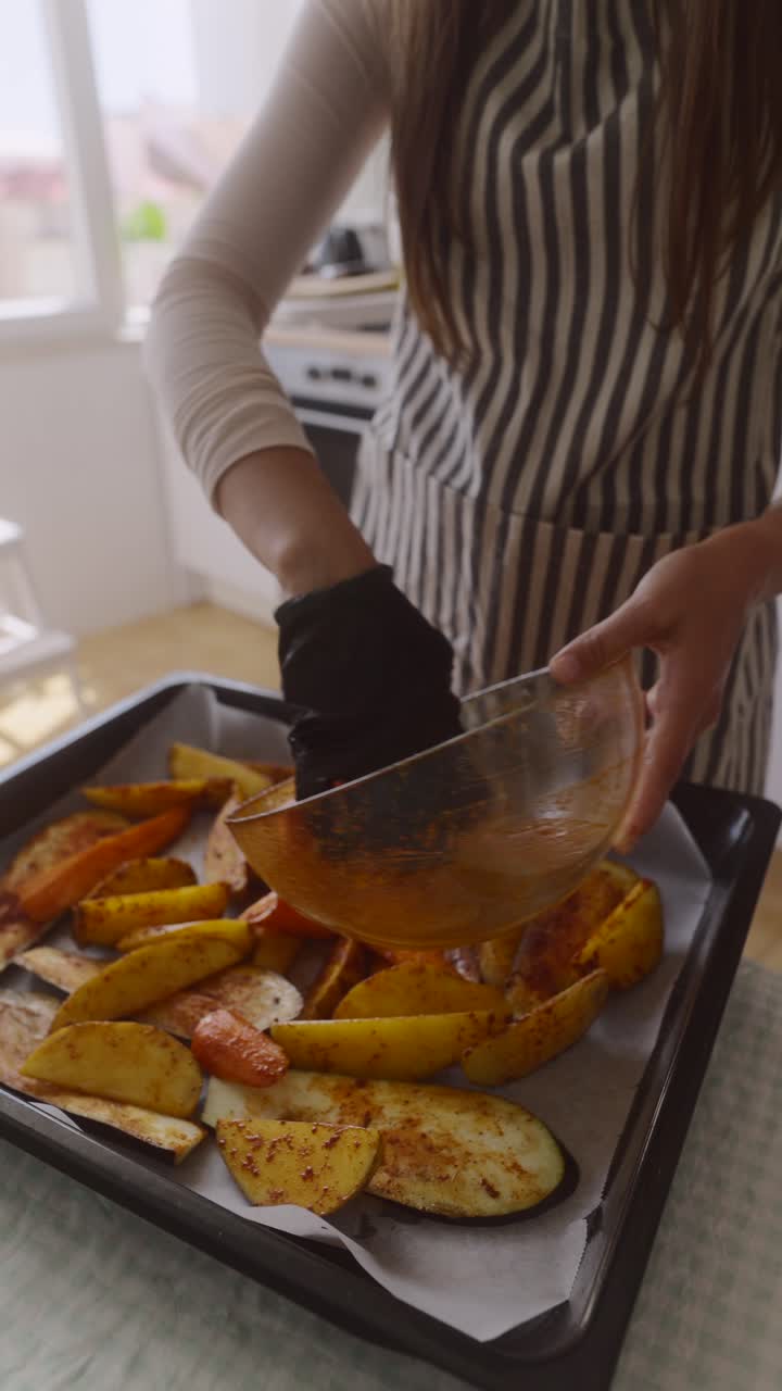 Woman preparing a dish of roasted vegetables