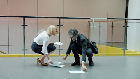 businesspeople in modern office corridor