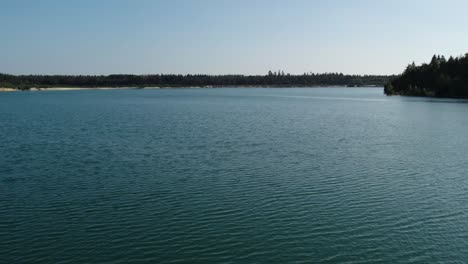 peaceful crystal blue lake during the day
