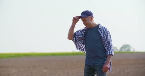 tired farmer walking in farm