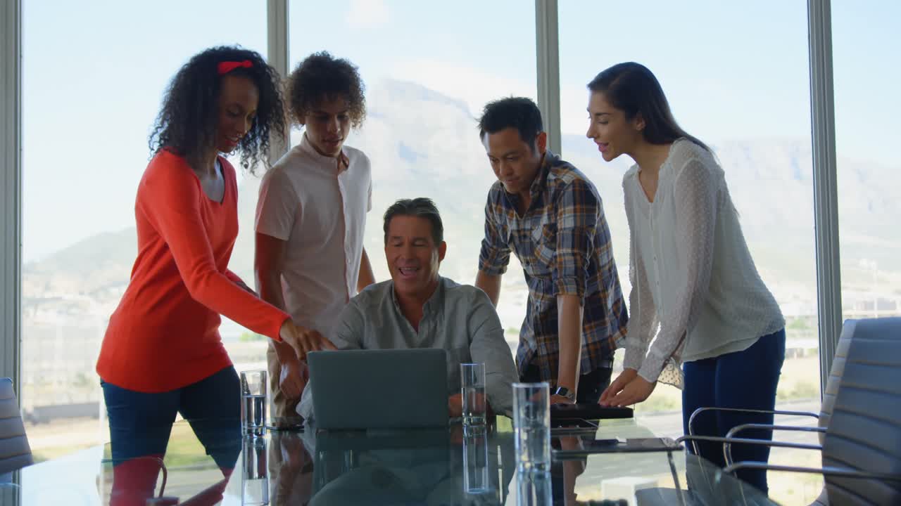 Business executives working on laptop in modern office 4k