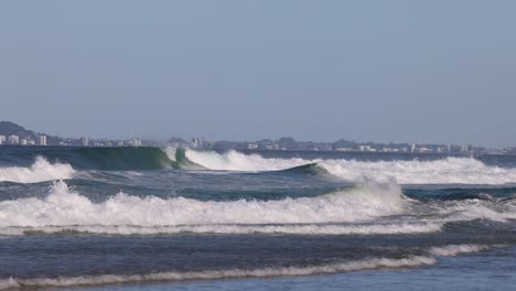 sequence of ocean waves approaching and breaking