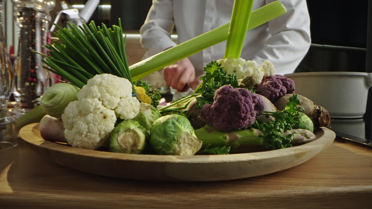 Chef preparing vegetables and onions in the kitchen