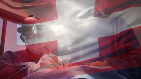 animation of flag of switzerland waving over surgeons in operating theatre