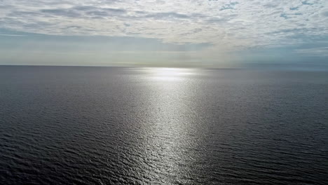 Aerial-drone-shot-over-the-sea-at-daytime