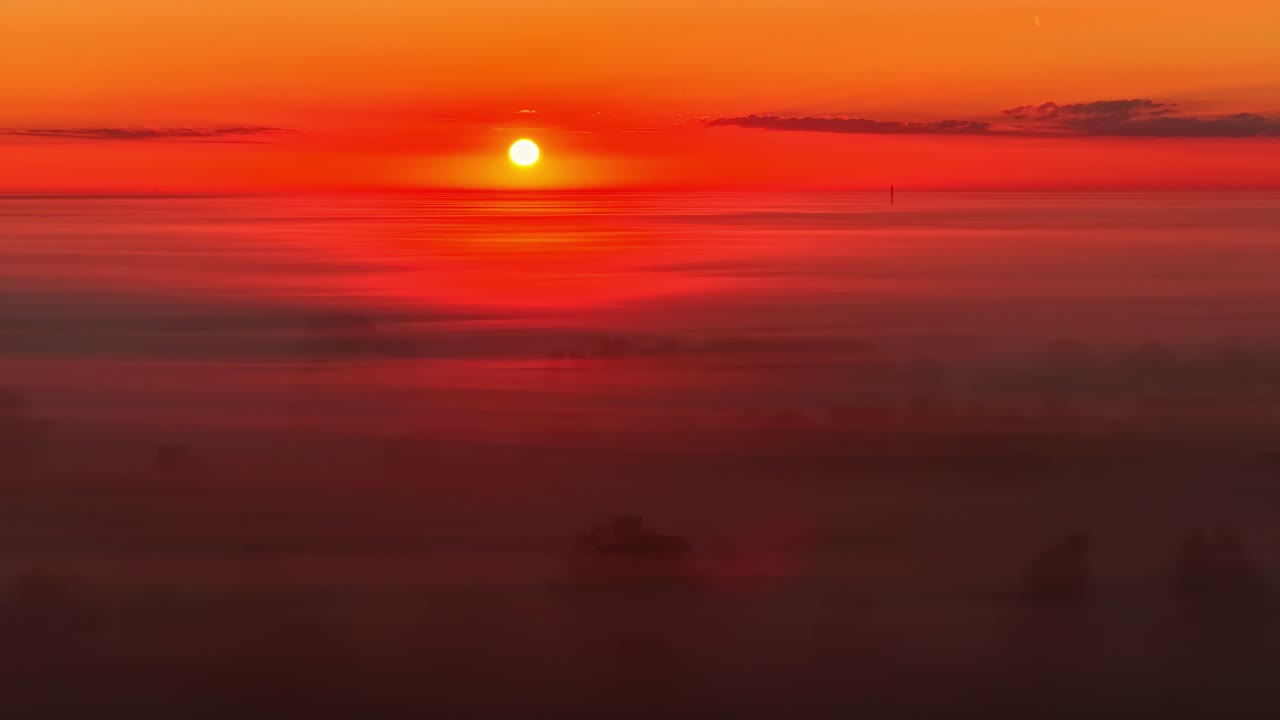 Red Hued Sky With Moonlight At Sunset. Static Shot