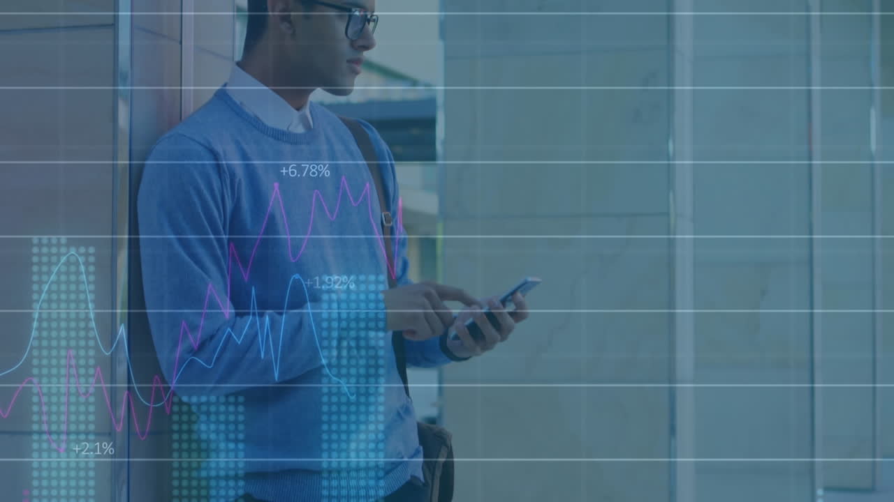 Animation of statistical data processing against biracial man using smartphone at office