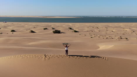 standing on the highest sand dune overlooking the nayla lagoon in morocco.