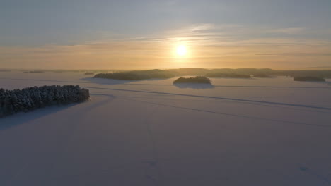 winter sunset over a vast frozen lake landscape