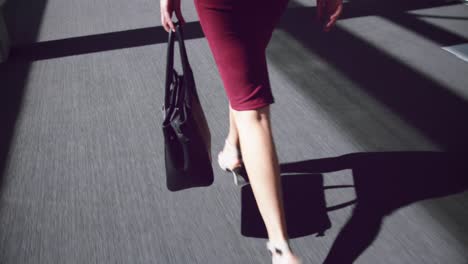 woman walking in the corridor at office 4k