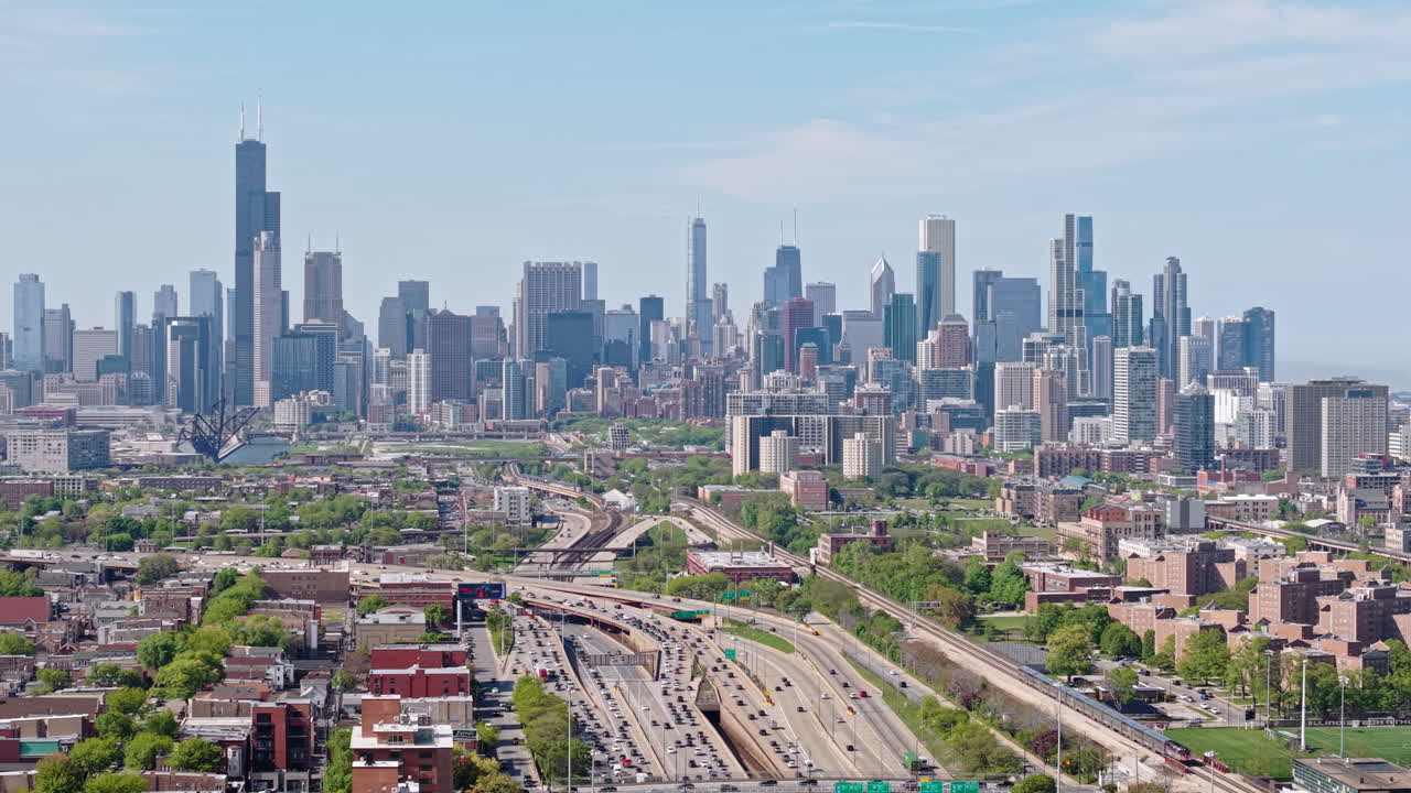 Chicago USA Highway and Railway Traffic, Drone Shot of I-90 Expressway, Train and Downtown Skyline From South