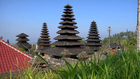 trees surrounds buildings of the besakih temple complex in bali 1