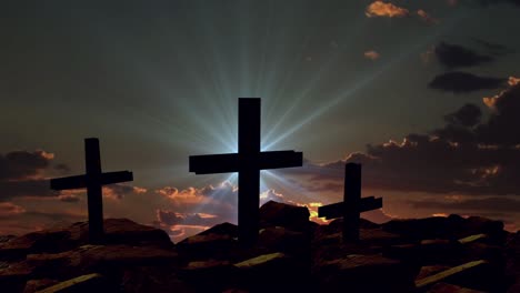 a cross over the rocks against a time lapse backdrop of sunset clouds