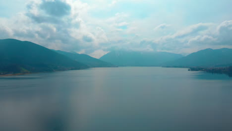 descending aerial shot of the tegernsee on a cloudy spring day