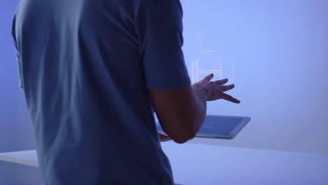 man interacting with a digital tablet