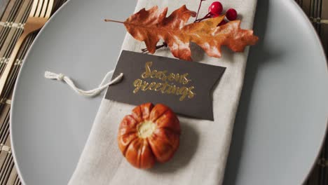 video of plate with autumn decoration lying on wooden mat