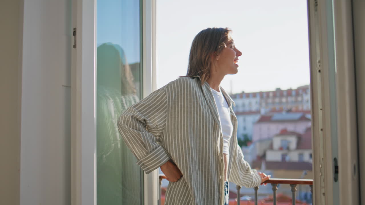 Relaxed girl urban landscape talking partner. Joyful woman resting evening home