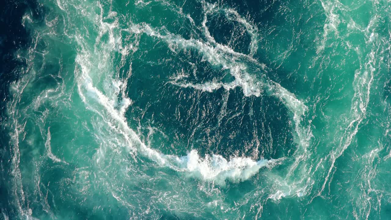 Blue waves of water of the river and the sea meet each other during high tide and low tide.