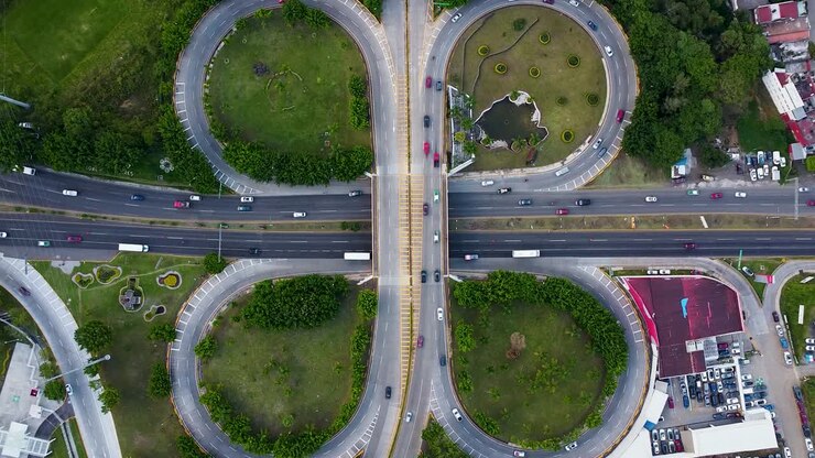 Aerial top down shot showing traffic on highway junction during daytime in Xalapa, Mexico