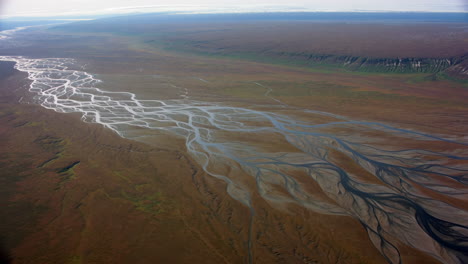 aerial view of a braided river system in a vast valley