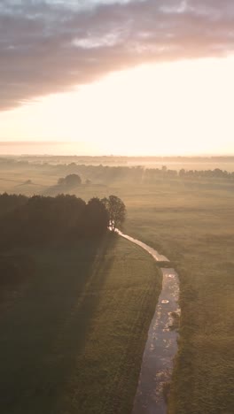 misty sunrise over rural landscape