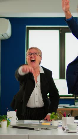 vertical video overjoyed multiethnic company team throwing up hands celebrating successful