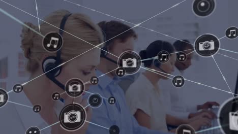 animation of network of connection with icons over business people wearing phone headsets