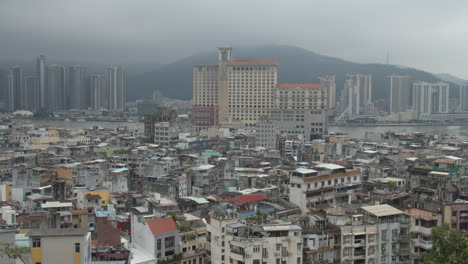 cityscape view of macau old buildings district from mount fortress on a gray overcast cloudy day, macau sar, china