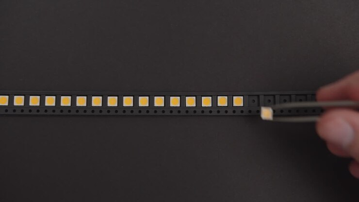 Manual Placement of Electronic Components in Black Container