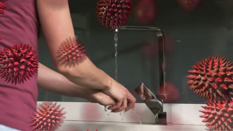 animation of macro coronavirus covid-19 cells spreading over caucasian woman washing her hands