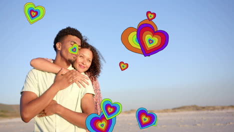 animation of hearts moving over diverse couple in love embracing on beach in summer