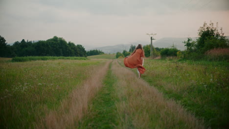 woman walking against a background of a beautiful mountain view