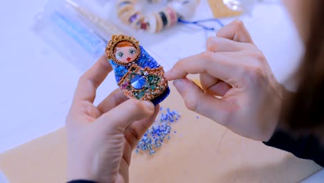 designer making handmade brooch