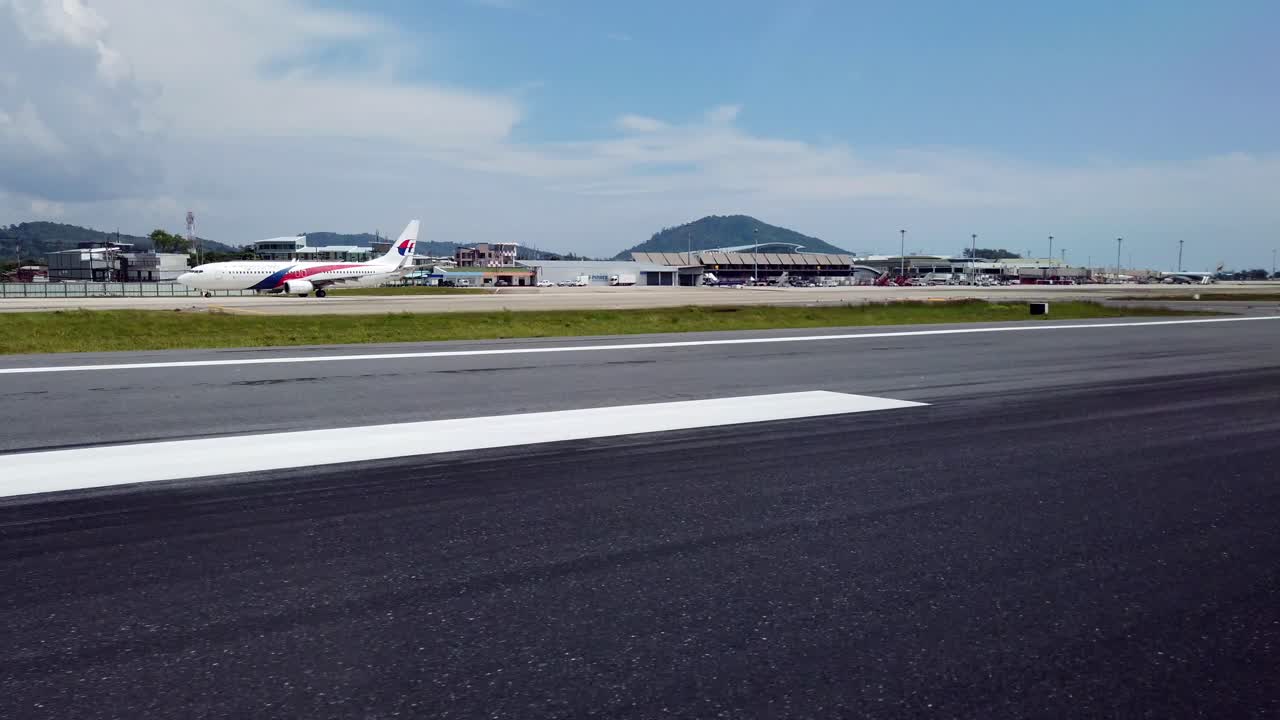 Landscape view of the airport terminal from inside the plane while on the runway in summer daytime-4k UHD video