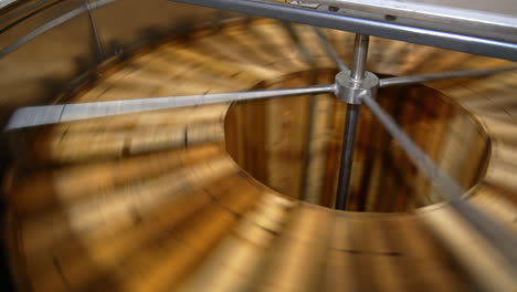 honey extraction with the help of electronic centrifuge machine. frames are rotated to get rid of honey . top view.