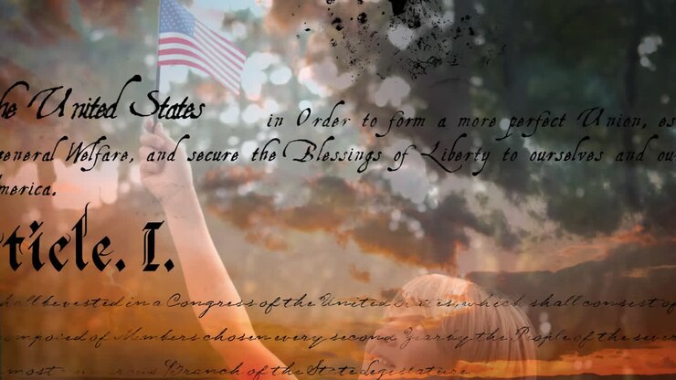 Written constitution of the United States and child holding American flag