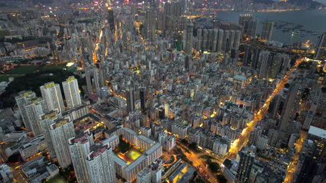 huge dense futuristic city wide angle drone shot early evening, hong kong