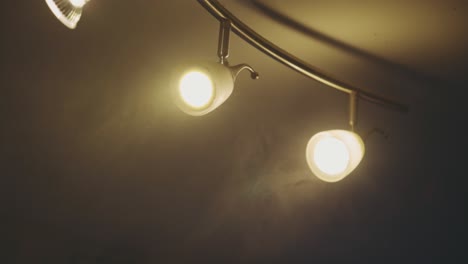 modern led spotlights on ceiling with dim-lit bulbs