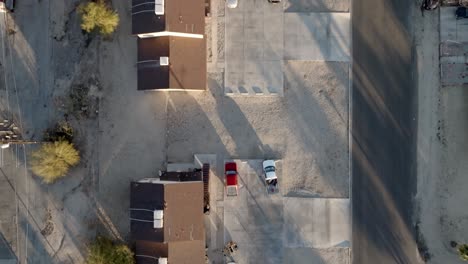 Neighborhood-in-Twenty-Nine-Palms,-California-with-drone-video-overhead-and-moving-forward