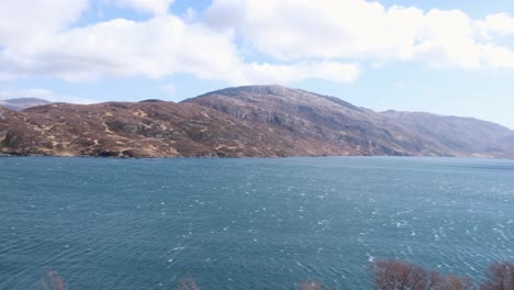 Panoramic-view-of-stunning-Loch-Gleann-Dubh-surrounded-by-rugged-Scottish-mountainous-landscape-in-the-highlands-of-Scotland-UK