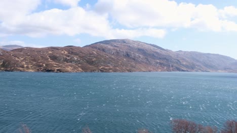 panoramic view of stunning loch gleann dubh surrounded by rugged scottish mountainous landscape in the highlands of scotland uk