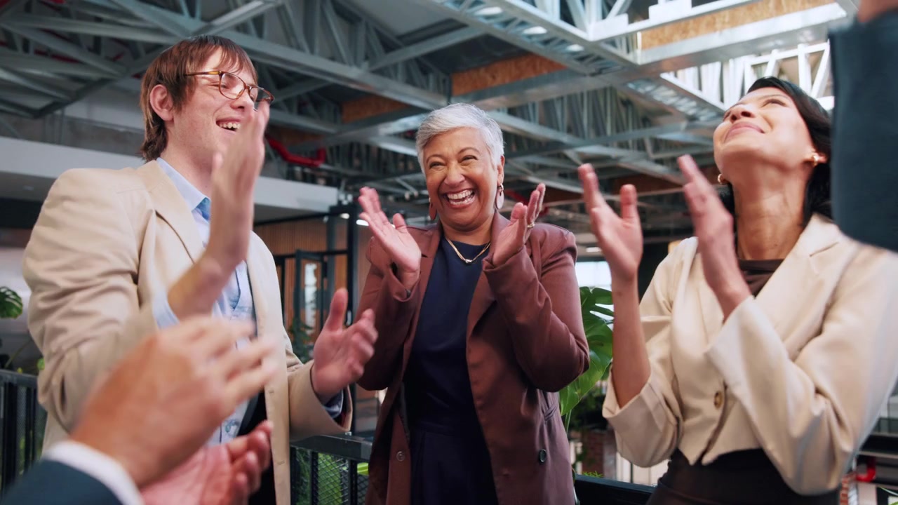 Diverse Business Team Celebrating Success in Modern Office