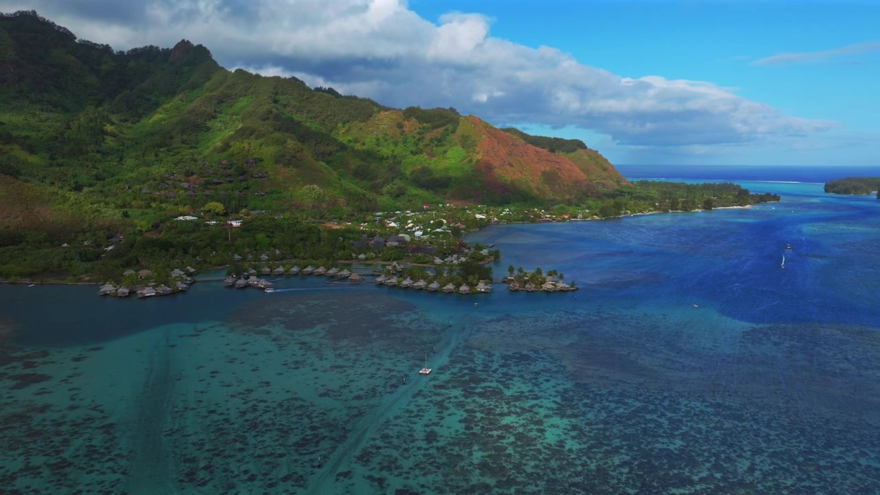Cook's Bay Opunohu Bay Ta'ahiamanu Public Beach Bora Bora Moorea French Polynesia aerial drone bungalows over coral reef channel sailboats yachts morning sunny blue sky clouds backwards pan up motion