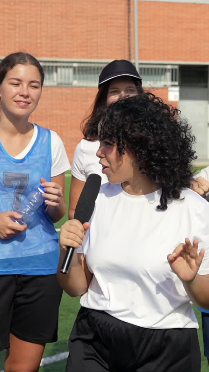 Women with microphone interviewing on field