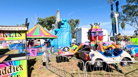 colorful kiddie rides and ticket booth at fun park