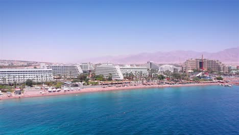aerial panorama of eilat's beach resorts and red sea coastline with desert mountains in background