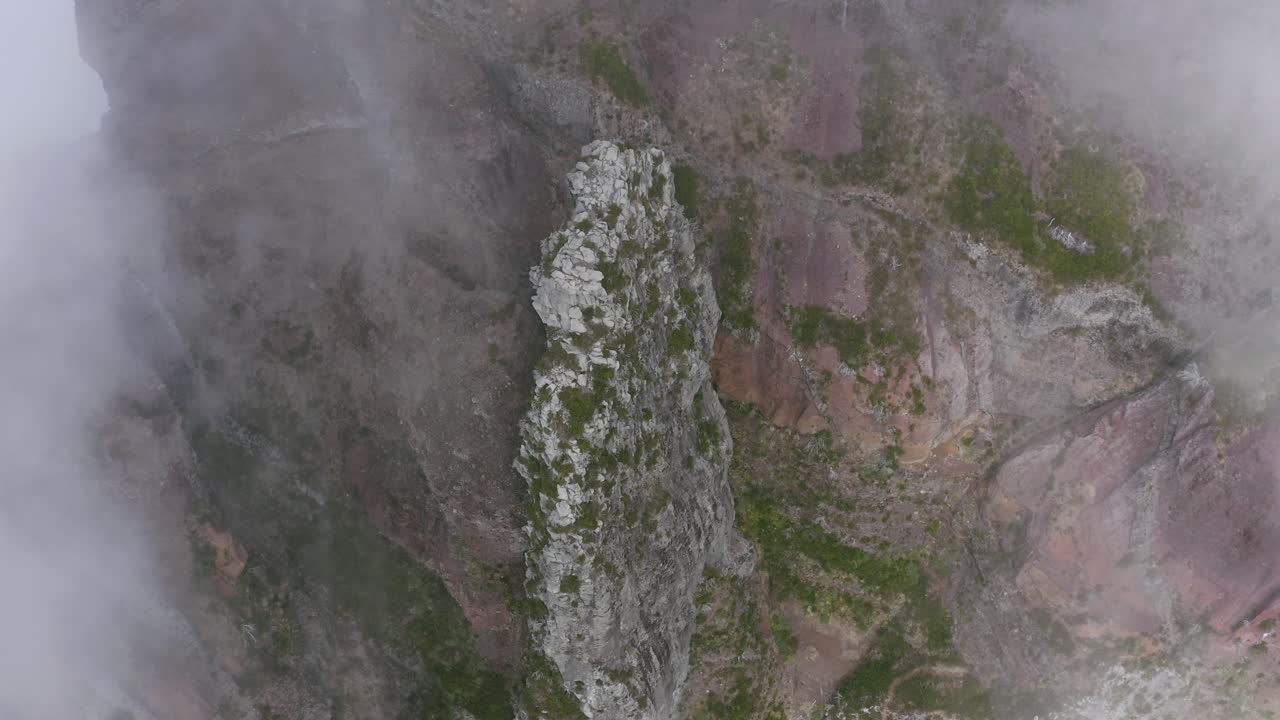 Aerial View of a Dramatic Mountain Cliff in the Fog