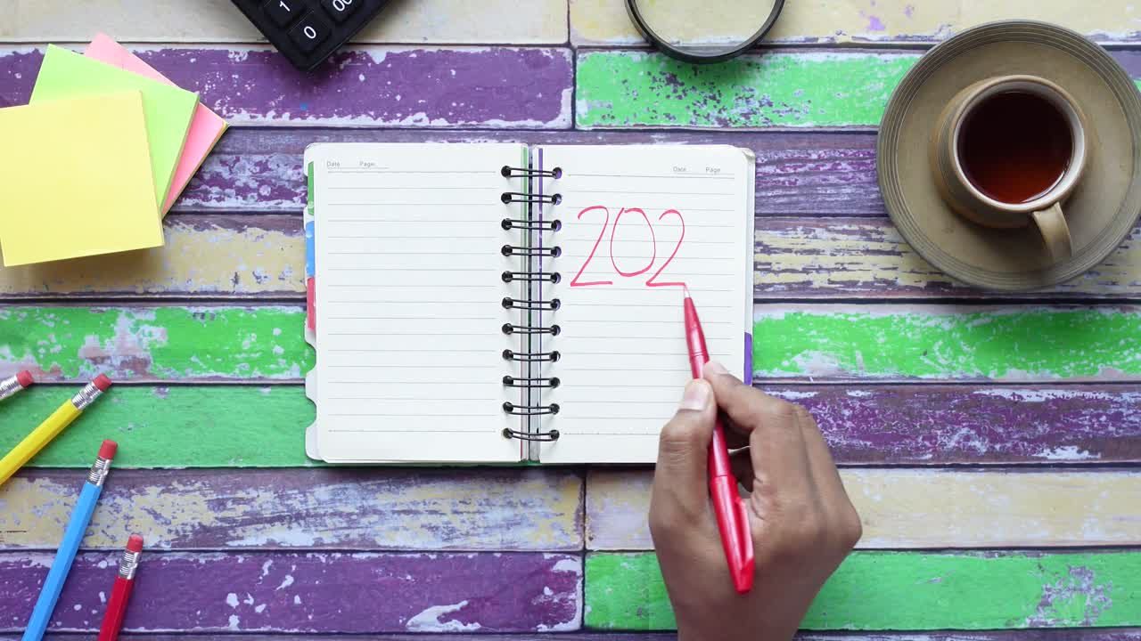 Writing Date 2022 in a Notebook